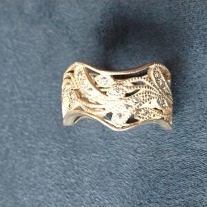 Beautiful Italian silver ring is marked 999. Ornate with clear crystal stones
